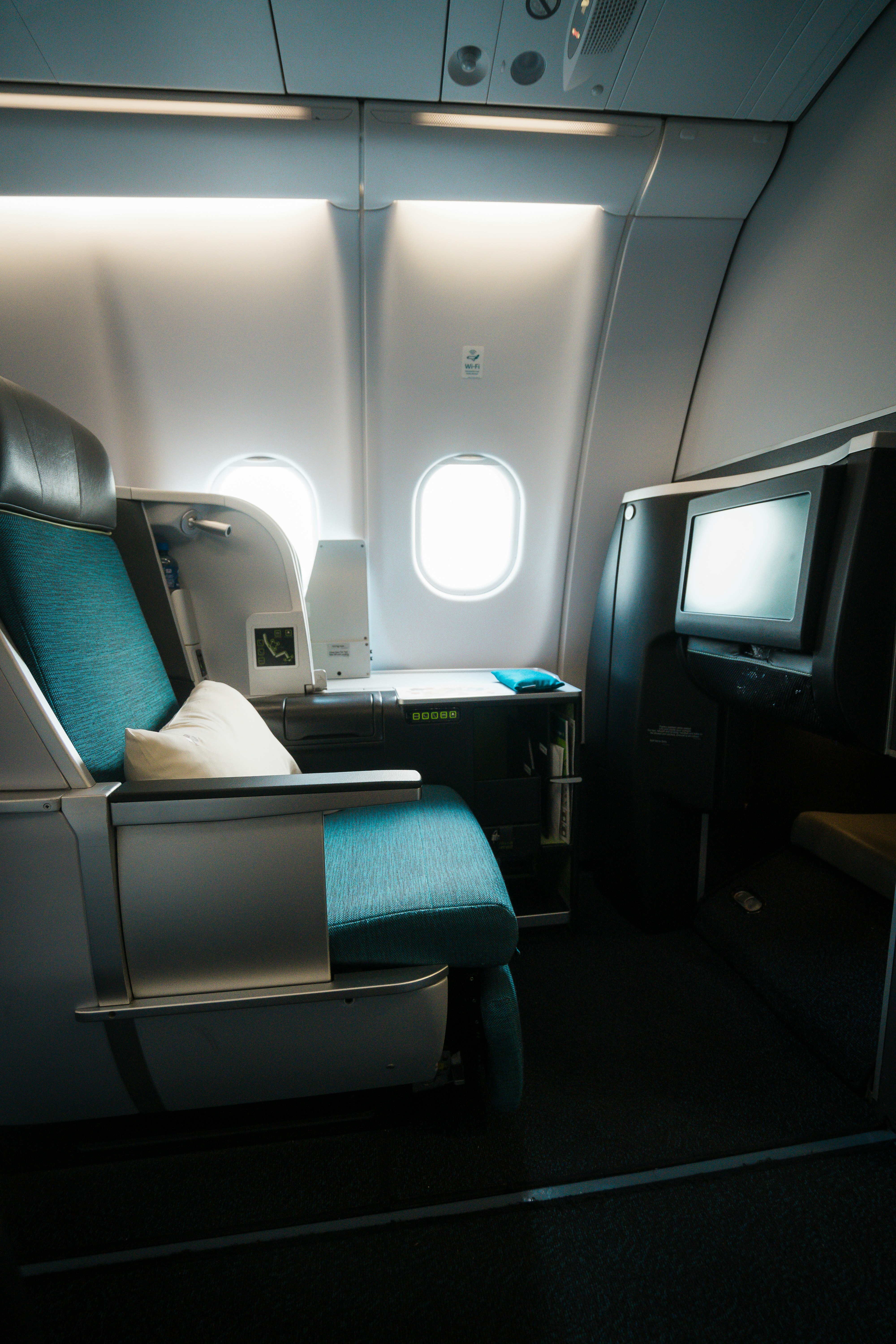 Business class lie-flat seat with champagne