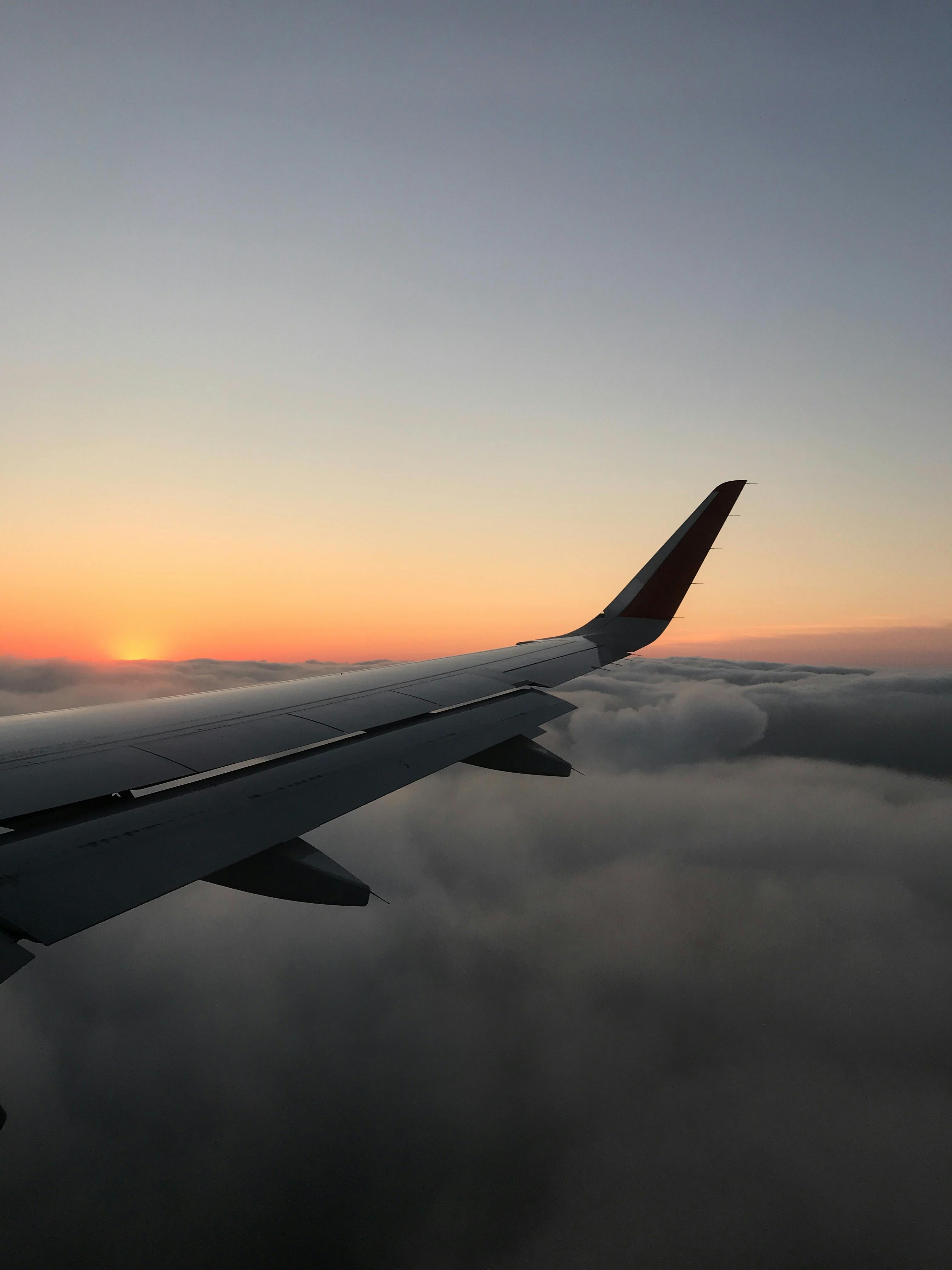 Airplane wing at sunset